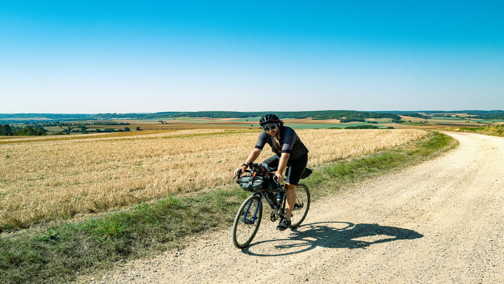 How can a cycling enthusiast ride 16,000 kilometers in a year?